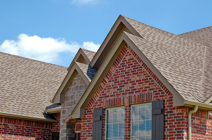 What Are the Pros and Cons of Asphalt vs. Wood Shingles? | MI Roofing Services